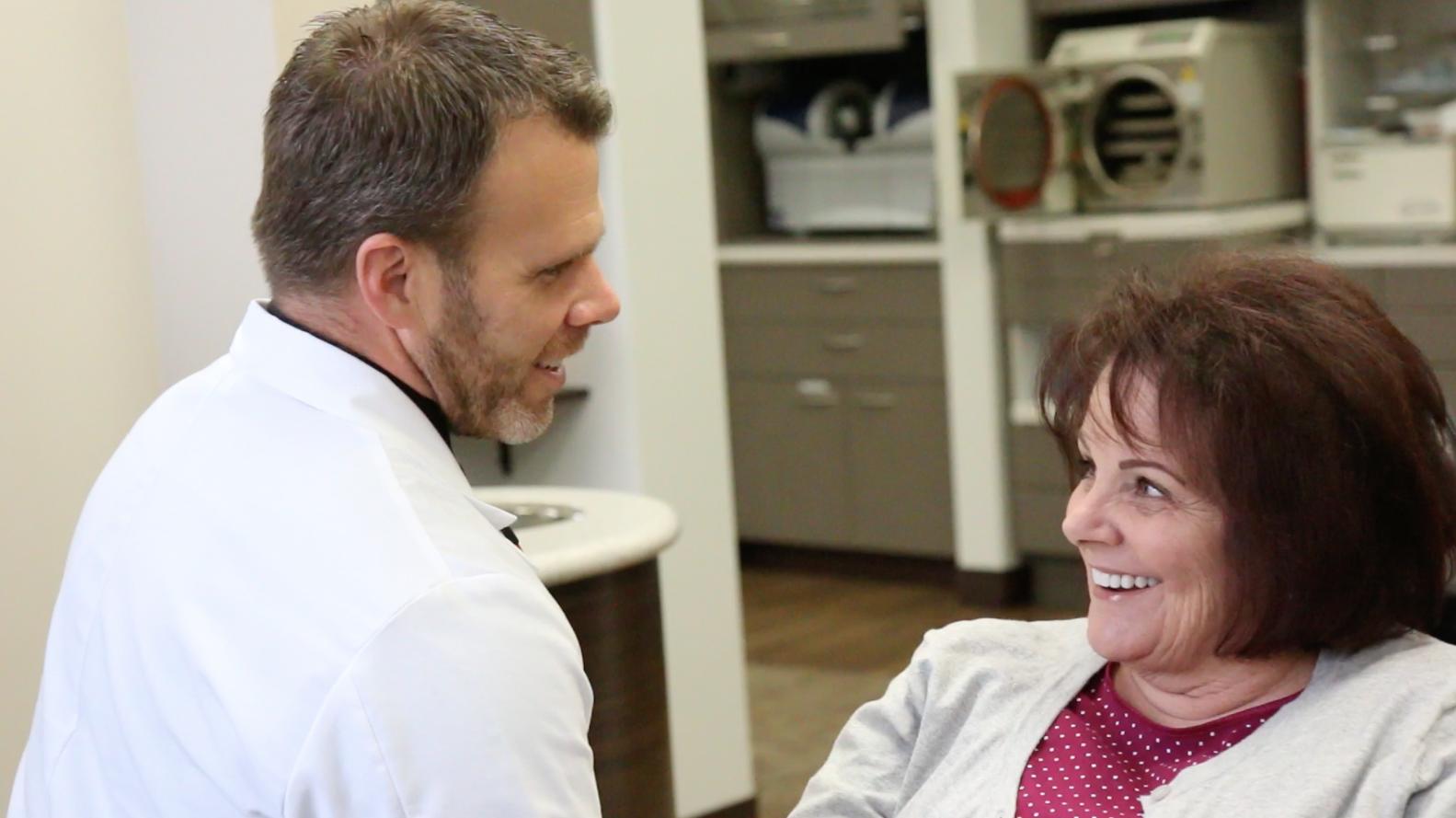 Dr. Jeffrey Allred discussing restorative dentistry options with a patient