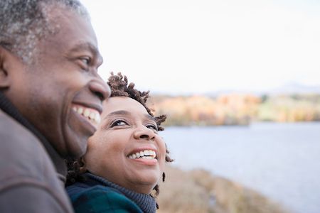 woman with dentures smiling at her husband