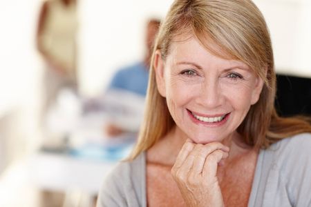 woman with dental implants smiling