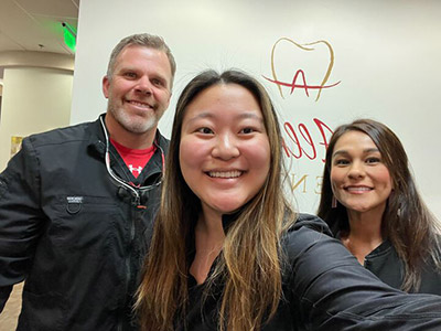 doctor with staff at Allred Dental in San Marcos, CA